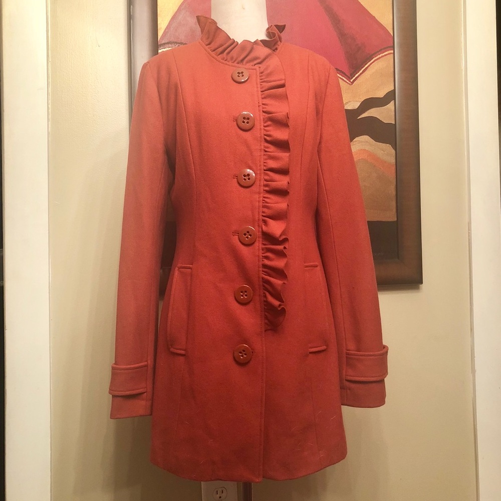 Burnt orange coat.